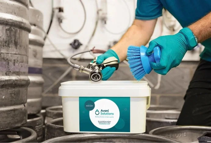 Avani Solutions technician cleaning beer dispense equipment
