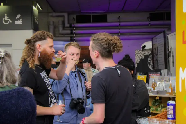 People tasting beer at disco bar 2023